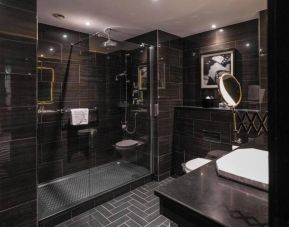 Guest bathroom with shower at Hotel Gotham.  