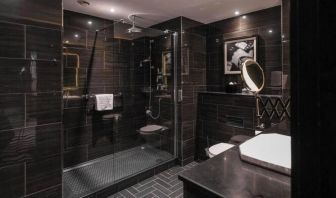 Guest bathroom with shower at Hotel Gotham.  