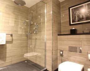 Guest bathroom with shower at Hotel Gotham.  