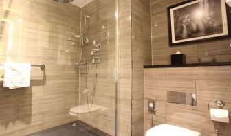 Guest bathroom with shower at Hotel Gotham.  