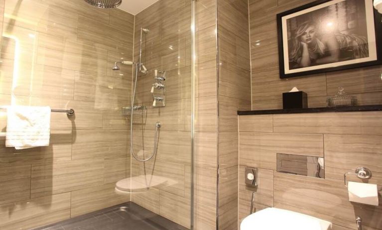 Guest bathroom with shower at Hotel Gotham.  