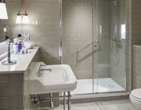 Guest bathroom with shower at The Midland - A Leonardo Royal Hotel.