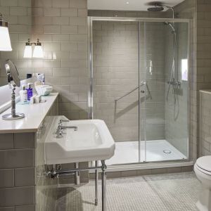 Guest bathroom with shower at The Midland - A Leonardo Royal Hotel.