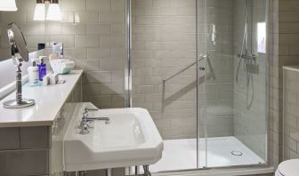 Guest bathroom with shower at The Midland - A Leonardo Royal Hotel.