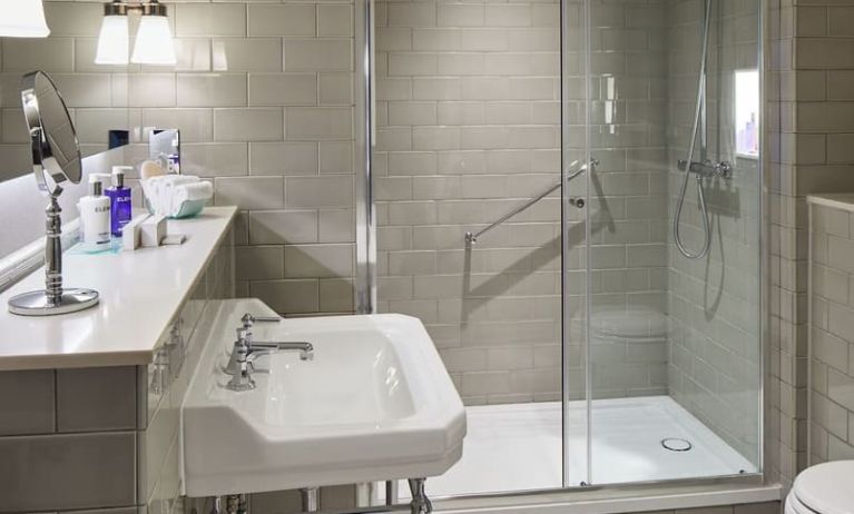 Guest bathroom with shower at The Midland - A Leonardo Royal Hotel.