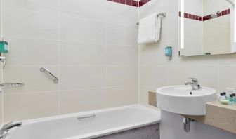 Guest bathroom with shower and tub at Leonardo Hotel Sheffield.