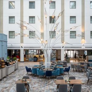 Dining area and lounge at Leonardo Royal Hotel Brighton Waterfront.