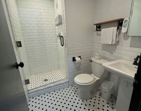 Guest bathroom with shower at Tribeca Hotel FiDi.