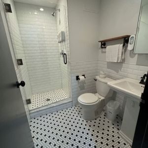 Guest bathroom with shower at Tribeca Hotel FiDi.