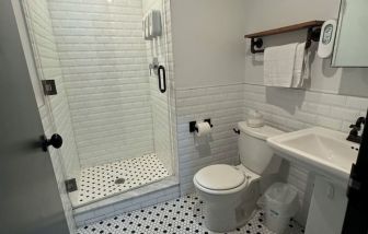 Guest bathroom with shower at Tribeca Hotel FiDi.