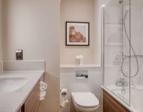 Guest bathroom with shower and tub at DoubleTree by Hilton Dartford Bridge.