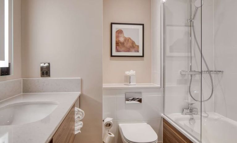 Guest bathroom with shower and tub at DoubleTree by Hilton Dartford Bridge.