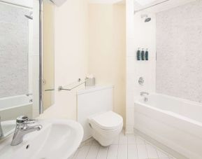 Guest bathroom with shower and tub at Hilton Northampton.