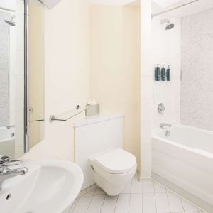 Guest bathroom with shower and tub at Hilton Northampton.