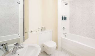 Guest bathroom with shower and tub at Hilton Northampton.