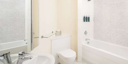 Guest bathroom with shower and tub at Hilton Northampton.