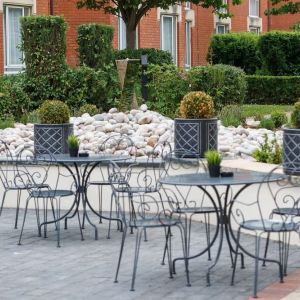 Seats and tables available in the garden at Hilton Northampton.