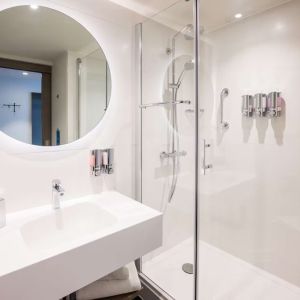 Guest bathroom with shower at Hampton By Hilton Blackpool.