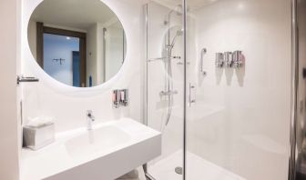 Guest bathroom with shower at Hampton By Hilton Blackpool.