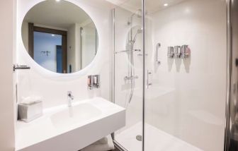 Guest bathroom with shower at Hampton By Hilton Blackpool.