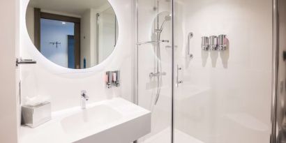 Guest bathroom with shower at Hampton By Hilton Blackpool.