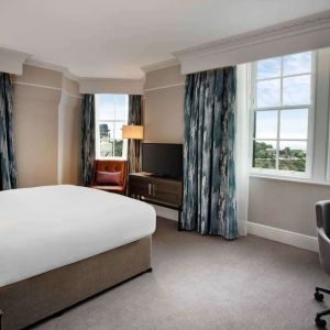 Day use room with large windows and work desk at Hilton Edinburgh Carlton.