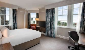 Day use room with large windows and work desk at Hilton Edinburgh Carlton.