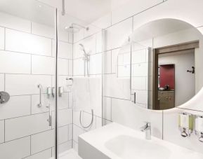 Guest bathroom with shower at Hampton By Hilton London City. 