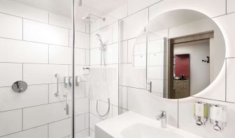 Guest bathroom with shower at Hampton By Hilton London City. 