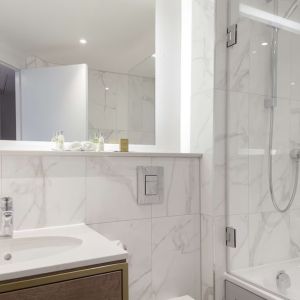 Guest bathroom with shower and tub at DoubleTree By Hilton Stoke On Trent.