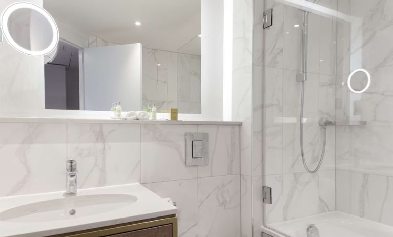 Guest bathroom with shower and tub at DoubleTree By Hilton Stoke On Trent.