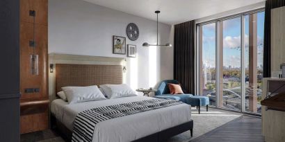 Bright king bedroom with view at The Gantry London, Curio Collection By Hilton.