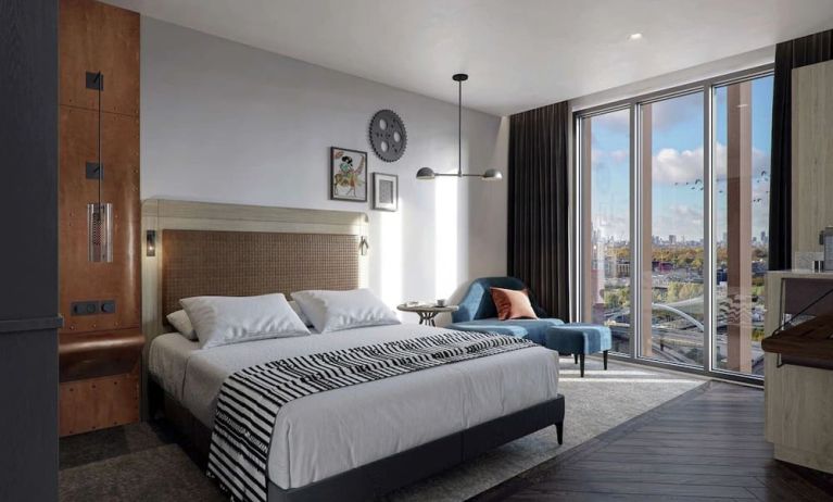 Bright king bedroom with view at The Gantry London, Curio Collection By Hilton.