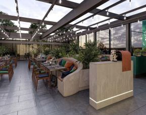 Dining area with natural light at The Gantry London, Curio Collection By Hilton.