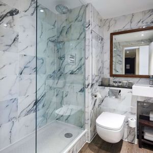 Guest bathroom with shower at DoubleTree By Hilton London Excel.
