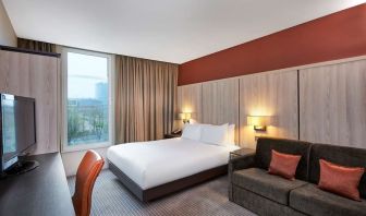 Day use room with sofa and large window at DoubleTree By Hilton London Excel.