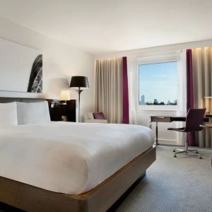 Delux king bed with work desk at Hilton London Angel Islington.
