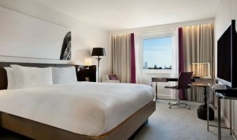 Delux king bed with work desk at Hilton London Angel Islington.
