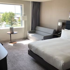 Day use room with work desk and sofa at Hilton Garden Inn Birmingham Airport.