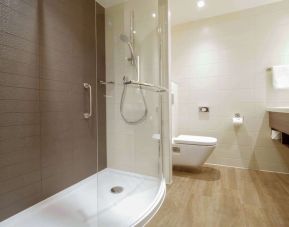 Guest bathroom with shower at Hilton Garden Inn Birmingham Airport.