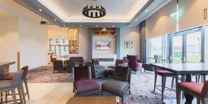 Lobby and coworking lounge at Hilton Garden Inn Birmingham Airport.