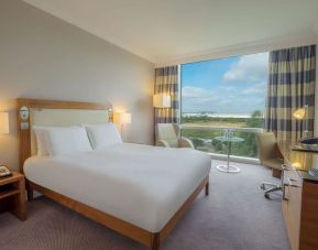 King guestroom with desk and TV screen at the Hilton Reading.