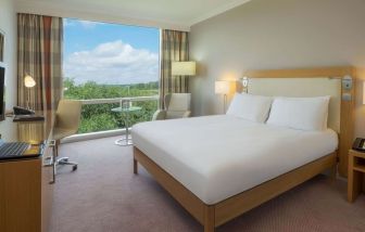 Bright king bedroom with view at the Hilton Reading.