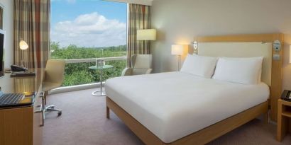 Bright king bedroom with view at the Hilton Reading.