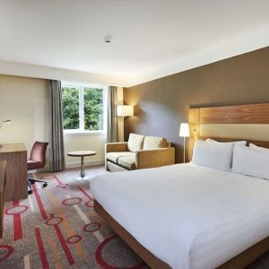 King guestroom with desk and sofa at the DoubleTree by Hilton Newbury North.