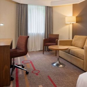 Day use room with work desk and lounge area at the DoubleTree by Hilton Newbury North.