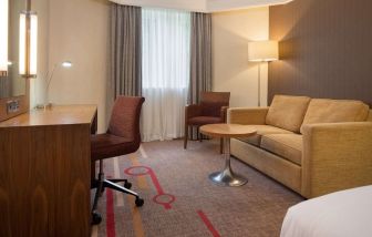 Day use room with work desk and lounge area at the DoubleTree by Hilton Newbury North.