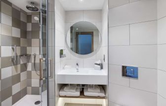 Guest bathroom with shower at Hampton By Hilton Torquay.