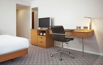 Day use room with TV and comfortable work desk at Hilton London Watford.