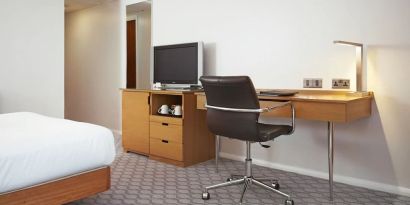 Day use room with TV and comfortable work desk at Hilton London Watford.